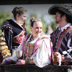 Minnesota Renaissance Festival - A man and two women riding on carriage!