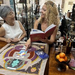 Robyn Buntin Of Honolulu Gallery - Judy Buntin and gallery assistant Mikela enjoying a new work of art by friend and magnificent artist, Mayumi Oda.