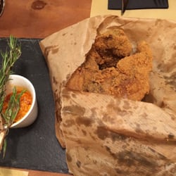 La Regadera - Lamb lollipops with romescu sauce.