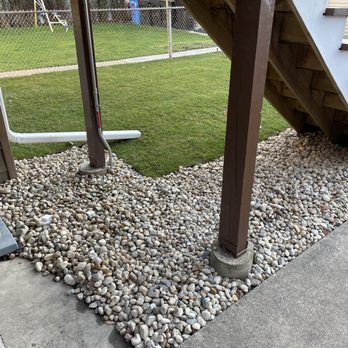 R.A.M. Landscape & Patio Design - New river rock added under the stairs to help with drainage. They had to excavate a lot of dirt and old rock first. - Landscaping Near Me - Chicago, Illinois R.A.M. Landscape & Patio Design - New river rock added under the stairs to help with drainage. They had to excavate a lot of dirt and old rock first. - Landscaping Near Me - Chicago, Illinois