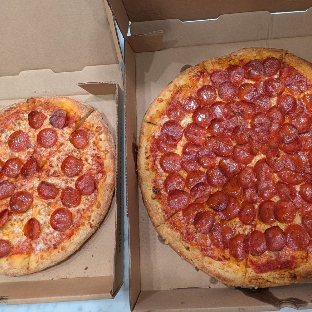 Suds Monkey Kitchen & Brewery Dripping Springs - 12" Pepperoni Pizza next to 16" Stingray Pizza - Brewpubs Near Me - Austin, Texas
