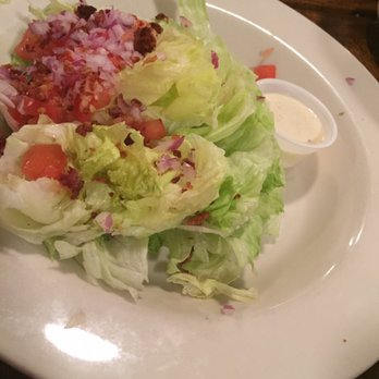 Ransom's Steakhouse - Wedge salad? Blue cheese dressing on the side in plastic. No crumbles & the iceberg was rusty and soft. Very disappointing. - Steakhouses Near Me - Montgomery, Texas