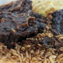 Unruly Jamaican Cuisine - Oxtail stew, rice and cabbage