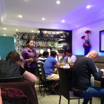 Taj Mahal - View of the dining room from the window. - Indian Near Me - Bruges, VWV Taj Mahal - View of the dining room from the window. - Indian Near Me - Bruges, VWV