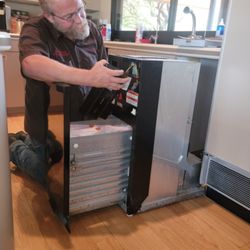 Steve Martin Appliance Repair - Steve working on a trash compactor