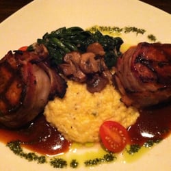 Due South Southern Cuisine - Bacon wrapped pork tenderloin medallions with grits and sautéed spinach