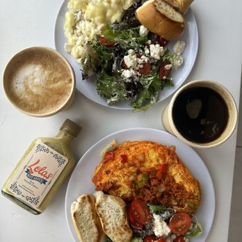 Lela's Eatery - Chorizo omelette and turkey/cheese scramble.  Both served with a side salad and pan sobao (bread). Latte and Americano - Desserts Near Me - San Juan, Puerto Rico