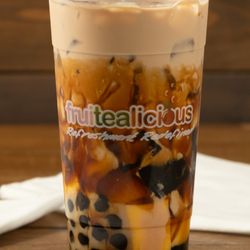 Try our Black Sugar Milk tea with honey boba, flan and grass jelly