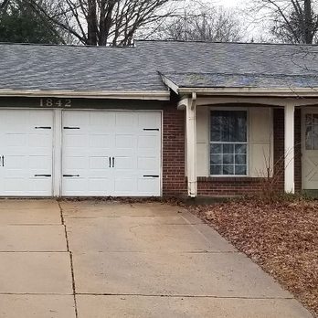 Complete Garage Door Services - Carriage house with handles and straps - Garage Door Services Near Me