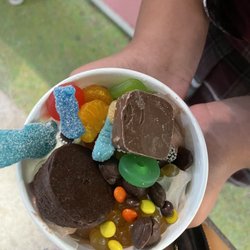 sweetFrog Premium Frozen Yogurt - cookie batter,chocolate,and cookies and creme sour gummy worms,lite savers,sour patch kids,Reese's pieces,mango boba,oranges,and brownie