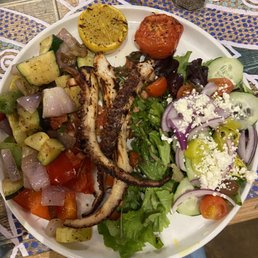 Octopus dinner with grilled veggies and side salad. Octopus dinner with grilled veggies and side salad.