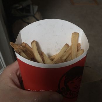 Wendy's - a hand holding a cup of french fries - Burgers Near Me - Woodstock, Georgia Wendy's - a hand holding a cup of french fries - Burgers Near Me - Woodstock, Georgia