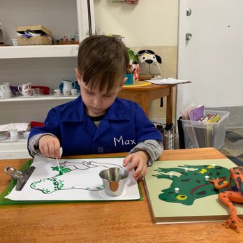 Steeple on the Beach Montessori - It's Friday Art class and my son is concentrating as he draws a frog - Montessori Schools Near Me - Deerfield Beach, Florida Steeple on the Beach Montessori - It's Friday Art class and my son is concentrating as he draws a frog - Montessori Schools Near Me - Deerfield Beach, Florida