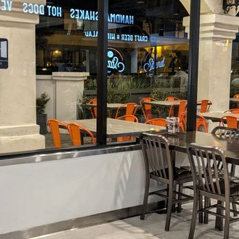 The Stand - American Classics Redefined - Outdoor patio on the other side of the window - New American Near Me - San Juan Capistrano, California