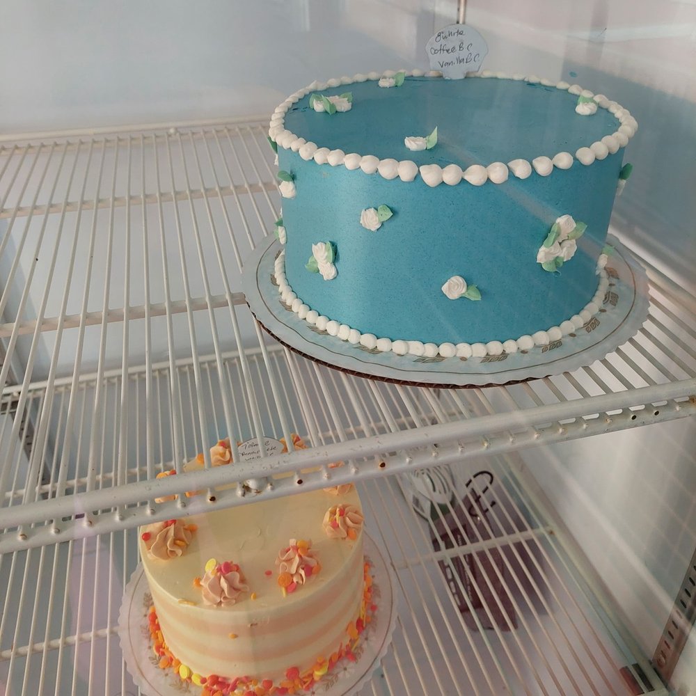 Some Crust Bakery - Coffee and vanilla blue and white flowers cake. Orange cake. - Bakeries Near Me - Claremont, California Some Crust Bakery - Coffee and vanilla blue and white flowers cake. Orange cake. - Bakeries Near Me - Claremont, California