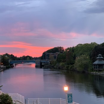 Bluefish Kitchen + Bar - Sunset off the back deck. - New American Near Me - Manistee, Michigan