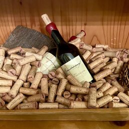 corks and a bottle of wine corks and a bottle of wine
