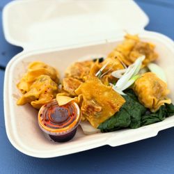 Mama Chow's Kitchen - Pork and shrimp dumplings are served over bok choy and comes with chili oil dipping sauce.
