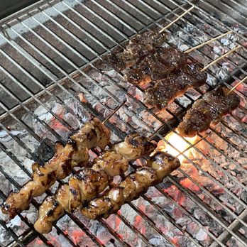 Soy Sauce Bento - skewered meat on a grill - Food Stands Near Me