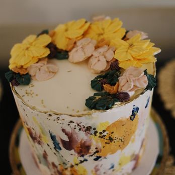 Syndesi Desserts - a cake decorated with flowers - Custom Cakes Near Me