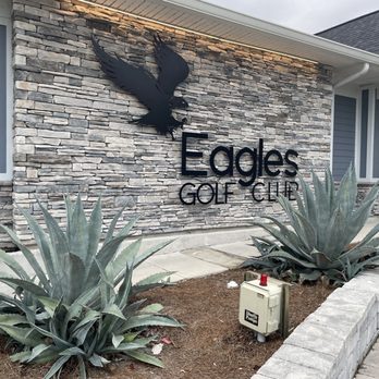 The Eagles Golf Club - Logo and clubhouse front - Golf Near Me - Odessa, Florida The Eagles Golf Club - Logo and clubhouse front - Golf Near Me - Odessa, Florida