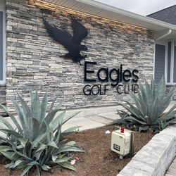 The Eagles Golf Club - Logo and clubhouse front