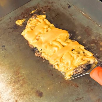 Make My Day Deli - a cheeseburger being cooked - Delis Near Me - Merrick, New York Make My Day Deli - a cheeseburger being cooked - Delis Near Me - Merrick, New York