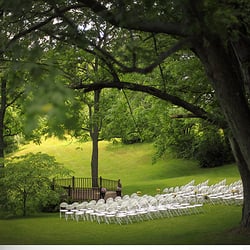 The Barn At Hidden Acres - A view of the gazebo area where a wedding can take place, overlooking a pond.