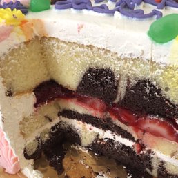 yellow-chocolate marble cake with fresh strawberries and whip cream frosting ~ yum!
