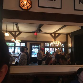 Allswell - Mirror at back of room reflecting the seating area. - New American Near Me - Brooklyn, New York