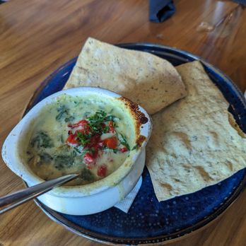 Crave Kitchen & Bar - Spinach and artichoke dip with a blend of cheeses - Bars Near Me - Eagle, Idaho
