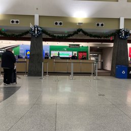 3 people working at the counter no one working on getting cars to customers waiting.