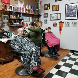 Catanzas Barber Shop - Angel and Maria giving some Christmas cuts.