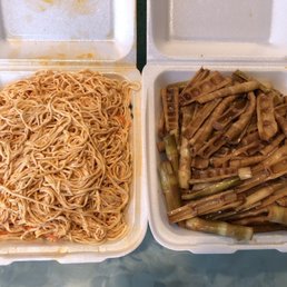 two containers of noodles and vegetables two containers of noodles and vegetables