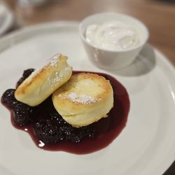 Syrniki! Best way to describe this is as a cheesecake covered in pancakes. Served with cherry compote and a side of sour cream.