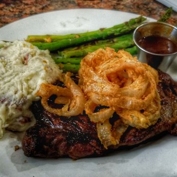 Shore Grille - Ribeye steak just as it is described on the menu. Cooked medium rare. Absolutely delicious flavours. - American Near Me - San Pedro, California Shore Grille - Ribeye steak just as it is described on the menu. Cooked medium rare. Absolutely delicious flavours. - American Near Me - San Pedro, California