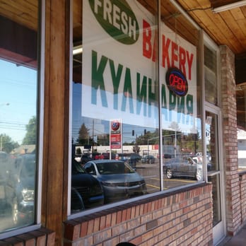 Russian Elegance Food - a bicycle parked in front of a bakery - Bakeries Near Me - Portland, Oregon