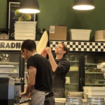 Radii Pi - Watching Ryan, the "Shop Manager and Pizza Perfectionist" toss the dough. - Pasta Shops Near Me - Portland, Oregon Radii Pi - Watching Ryan, the "Shop Manager and Pizza Perfectionist" toss the dough. - Pasta Shops Near Me - Portland, Oregon