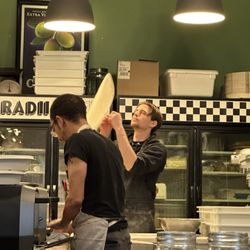 Radii Pi - Watching Ryan, the "Shop Manager and Pizza Perfectionist" toss the dough.