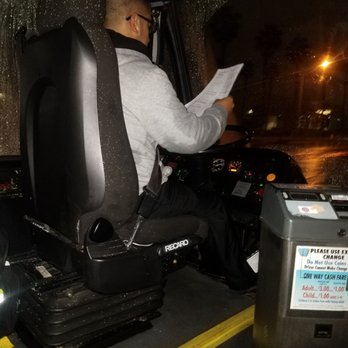 Anaheim Regional Transportation - Route 17, 5:55 am February 14 2019. Eric, operating a full-size bus in the pouring rain while reading from a piece of paper. - Public Transportation Near Me - Anaheim, California