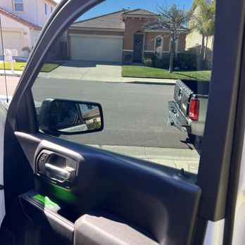 Tint Plus - Green Precaution reminder on window switch to remind not to roll down window for a few days. - Home Window Tinting Near Me - Santa Clarita, California