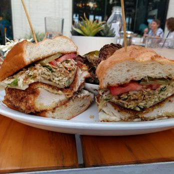 Down On Grayson - Fried chicken sandwich with side of Brussels sprouts - New American Near Me - San Antonio, Texas