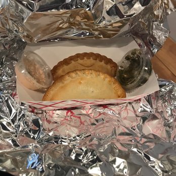 DelSur Empanadas - Take out order of Caprese and a Mushroom empanada.  Each empanada has the Del Sur name and a flavor code in the pastry dough. - Food Trucks Near Me - Minnetonka, Minnesota