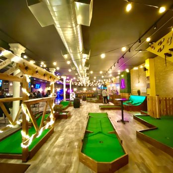 Big Mini Putt Club - Holes 1, 9 and 8 from left to right in the foreground. - Mini Golf Near Me - Chicago, Illinois Big Mini Putt Club - Holes 1, 9 and 8 from left to right in the foreground. - Mini Golf Near Me - Chicago, Illinois