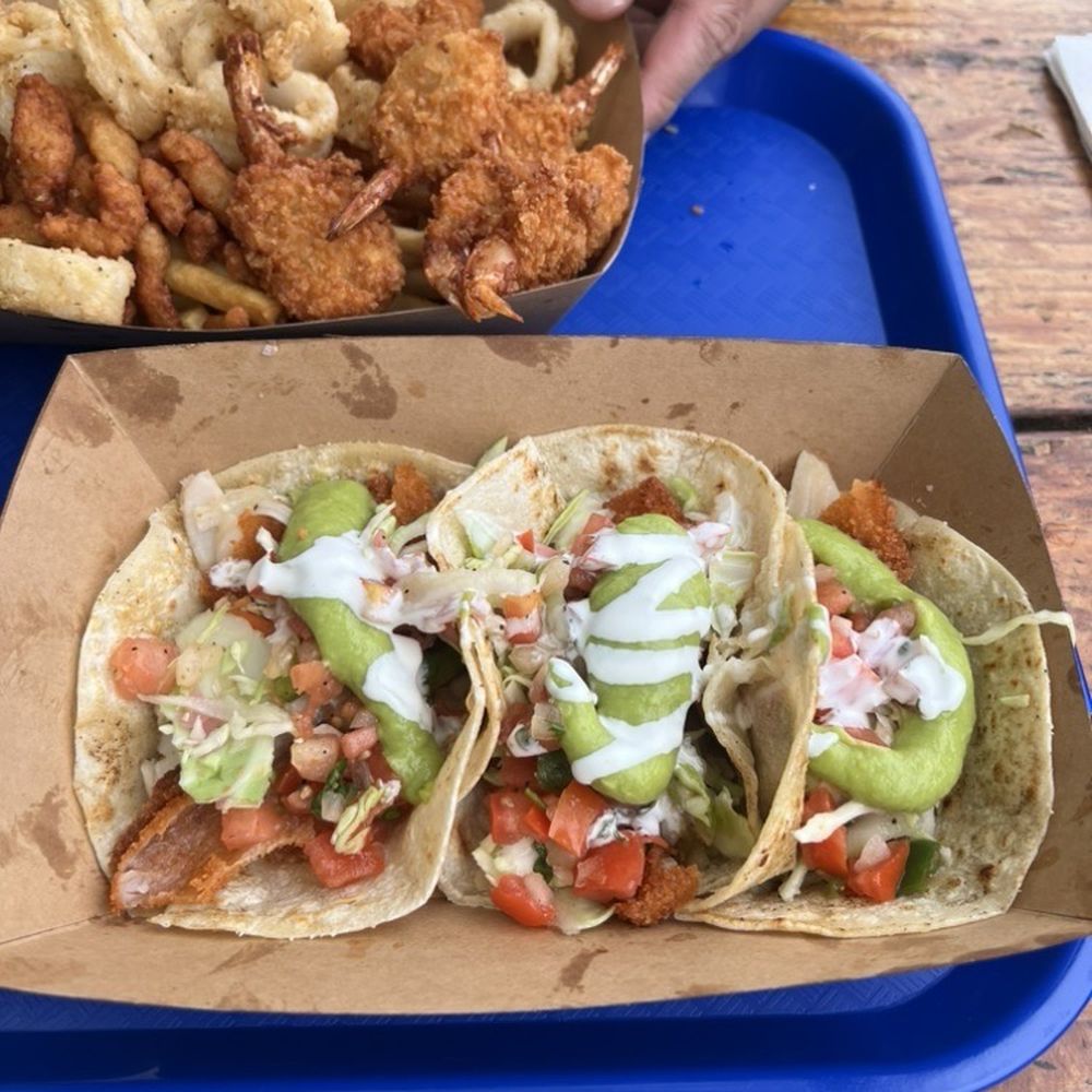 deep fried fish tacos: deep rid seasonal Alaskan white fish, pineapple slaw, pico, crema, avocado sauce on corn tortillas = $17.95 deep fried fish tacos: deep rid seasonal Alaskan white fish, pineapple slaw, pico, crema, avocado sauce on corn tortillas = $17.95