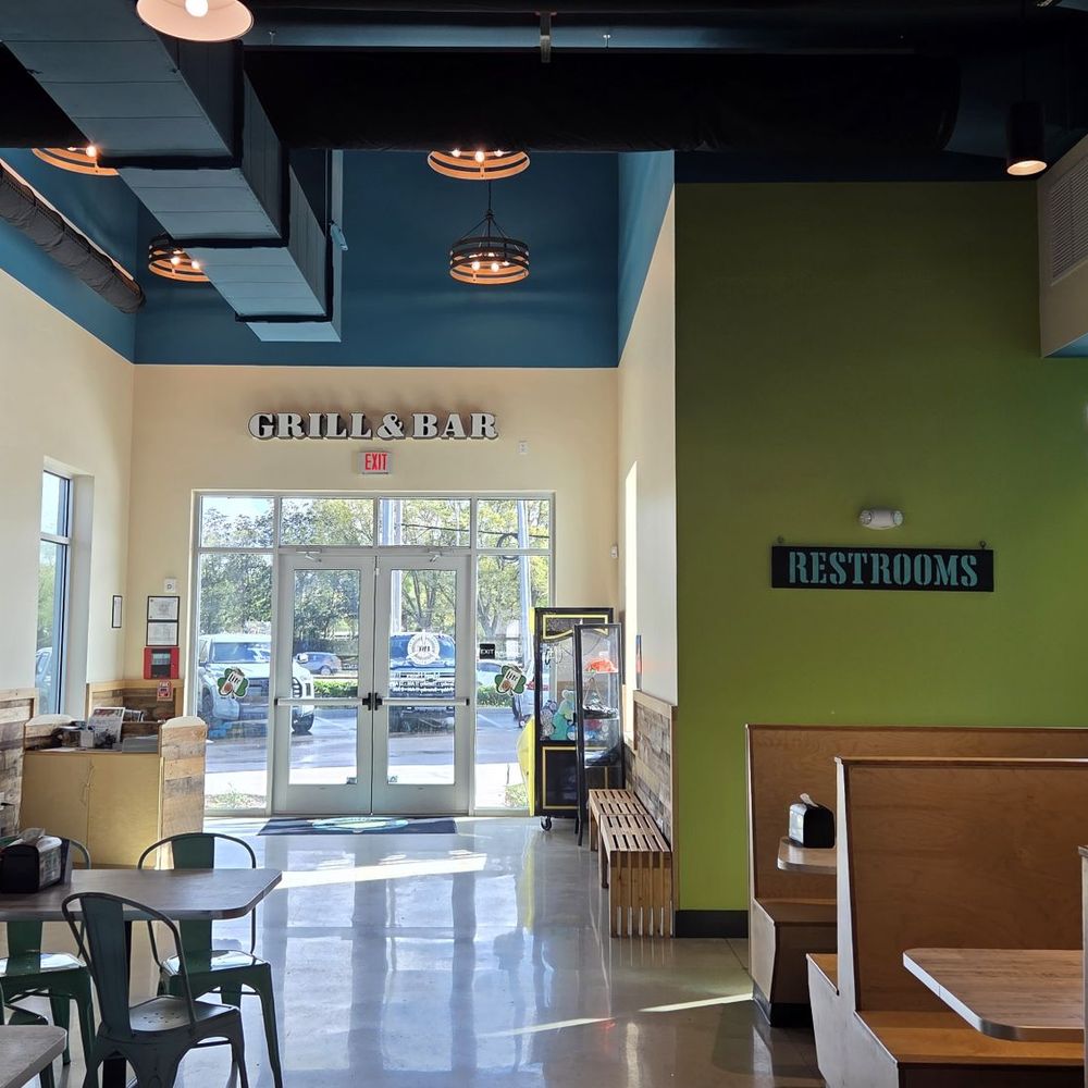 Island Wing - Entrance and signage for mens and women's restrooms. - American Near Me - Jacksonville, Florida