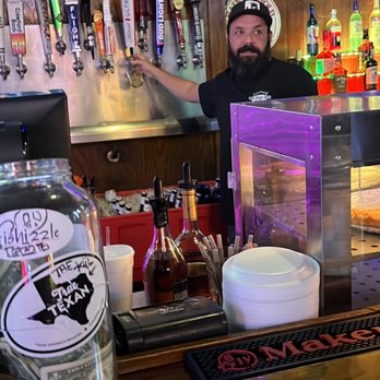 The Page Pub & Pizzeria - a bartender behind the bar - Pizza Near Me - Longview, Texas The Page Pub & Pizzeria - a bartender behind the bar - Pizza Near Me - Longview, Texas