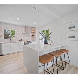 Quality Granite & Cabinets - Mcm kitchen remodel with waterfall quartz countertop and modern shaker white cabinets