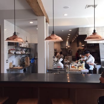 Saltbox Kitchen - Open kitchen with counter seats. - New American Near Me - Concord, Massachusetts