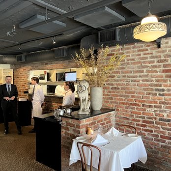 Hutch's - a group of people in a kitchen - New American Near Me - Buffalo, New York